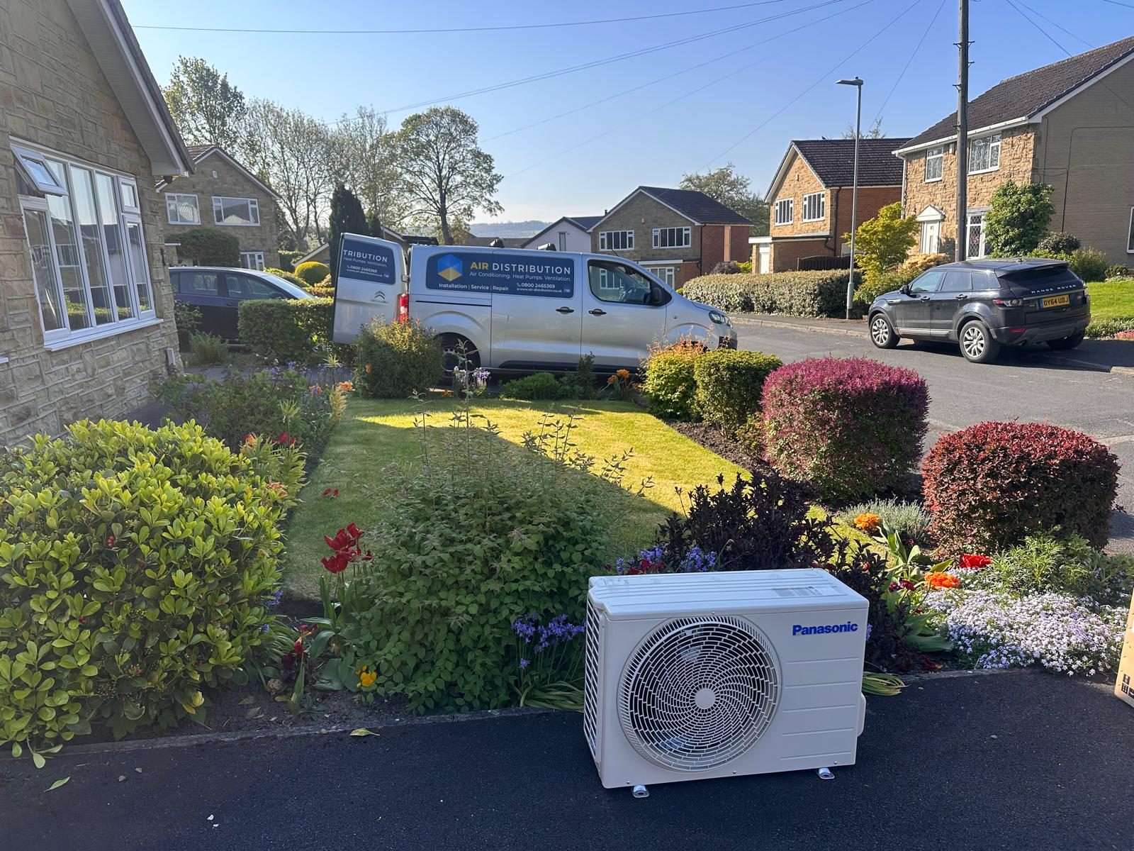 Air Distribution van parked at a customer's home during an installation